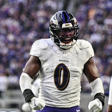 Nov 9, 2025; Minneapolis, Minnesota, USA; Baltimore Ravens linebacker Roquan Smith (0) reacts with cornerback Chidobe Awuzie (3) during the third quarter against the Minnesota Vikings at U.S. Bank Stadium. Mandatory Credit: Jeffrey Becker-Imagn Images