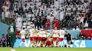 Poland celebrate a group stage victory against Saudi Arabia