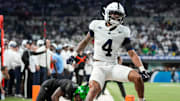 Penn State Nittany Lions cornerback A.J. Harris (4) breaks up a pass Saturday, Dec. 7, 2024, during the Big Ten Championship game at Lucas Oil Stadium in Indianapolis.