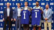 Apr 25, 2025; East Rutherford, NJ, US; New York Giants president John Mara (far left), general manager Joe Schoen (left), Jaxson Dart, Abdul Carter, and head coach Brian Daboll (right) pose for photos prior to the start of the press conference to introduce the Giants first round draft picks.  Mandatory Credit: Thomas Salus-Imagn Images