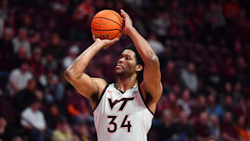 Jan 27, 2024; Blacksburg, Virginia, USA; Virginia Tech Hokies forward Mylyjael Poteat (34) shoots a technical foul shot during the second half at Cassell Coliseum. Mandatory Credit: Brian Bishop-Imagn Images