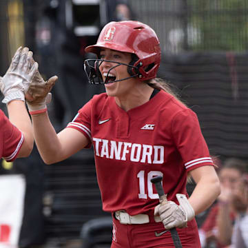 Stanford’s Taryn Kern, left, celebrates the first score of the fame with teammate 	Jade Berry during first inning of the Eugene NCAA Softball Regional May 17, 2025.