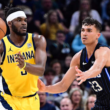 Apr 11, 2025; Indianapolis, Indiana, USA; Indiana Pacers forward Jarace Walker (5) passes the ball away from Orlando Magic forward Tristan da Silva (23) during the second half at Gainbridge Fieldhouse. Mandatory Credit: Marc Lebryk-Imagn Images