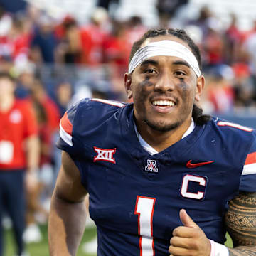 Nov 8, 2025; Tucson, Arizona, USA; Arizona Wildcats quarterback Noah Fifita (1) against the Kansas Jayhawks at Arizona Stadium. Mandatory Credit: Mark J. Rebilas-Imagn Images