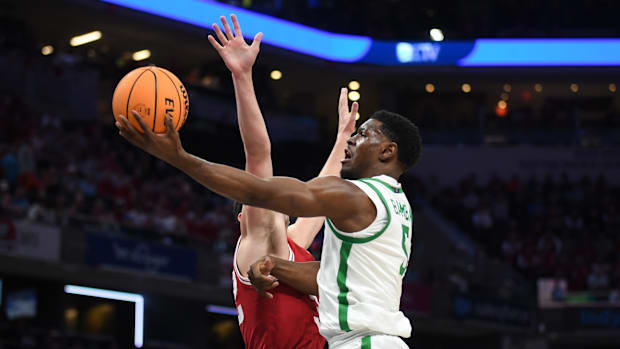  Oregon Ducks guard TJ Bamba (5) shoots past Indiana Hoosiers guard Trey Galloway (32) during the first half