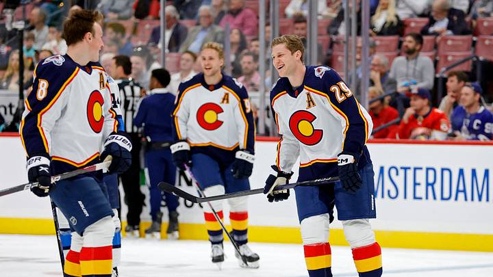 Feb 3, 2023; Sunrise, Florida, USA; Colorado Avalanche center Nathan MacKinnon (right) laughs while talking with defensemen Cale Makar (left) during the 2023 NHL All-Star Skills Competition at FLA Live Arena. Mandatory Credit: Sam Navarro-USA TODAY Sports