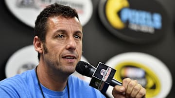 Jul 19, 2015; Loudon, NH, USA; Movie actor Adam Sandler speaks to the media before the 5-Hour Energy 301 at New Hampshire Motor Speedway. Mandatory Credit: Jasen Vinlove-Imagn Images