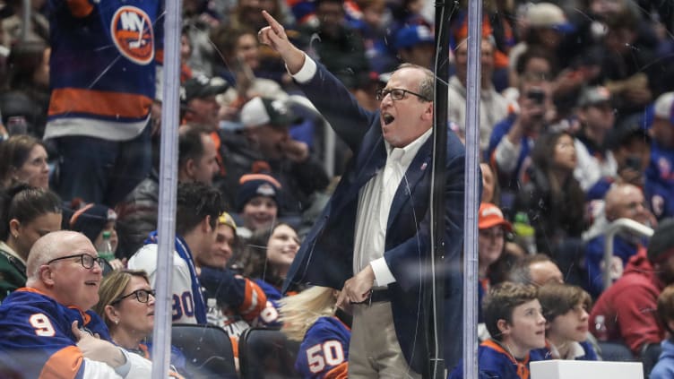 Mar 25, 2023; Elmont, New York, USA;  New York Islanders owner Jon Ledecky sings with the crowd during a timeout in the second period against the Buffalo Sabres at UBS Arena. Mandatory Credit: Wendell Cruz-USA TODAY Sports