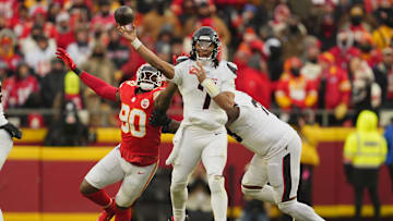Jan 18, 2025; Kansas City, Missouri, USA; Houston Texans quarterback C.J. Stroud (7) throws a pass against Kansas City Chiefs defensive end Charles Omenihu (90) during the third quarter of a 2025 AFC divisional round game at GEHA Field at Arrowhead Stadium.