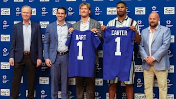 Apr 25, 2025; East Rutherford, NJ, US; New York Giants president John Mara (far left), general manager Joe Schoen (left), Jaxson Dart, Abdul Carter, and head coach Brian Daboll (right) pose for photos prior to the start of the press conference to introduce the Giants first round draft picks.  Mandatory Credit: Thomas Salus-Imagn Images