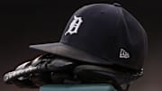 Jul 30, 2021; Detroit, Michigan, USA; The hat and glove of Detroit Tigers right fielder Robbie Grossman (8) sits on the ledge of the dugout during the first inning against the Baltimore Orioles at Comerica Park. 