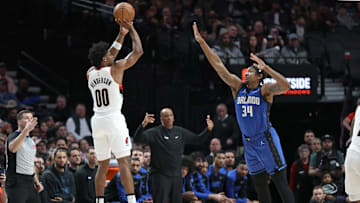 Jan 30, 2025; Portland, Oregon, USA: Portland Trail Blazers guard Scoot Henderson (00) shoots the ball over Orlando Magic center Wendell Carter Jr. (34) in the second half at Moda Center. Mandatory Credit: Jaime Valdez-Imagn Images