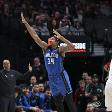 Jan 30, 2025; Portland, Oregon, USA: Portland Trail Blazers guard Scoot Henderson (00) shoots the ball over Orlando Magic center Wendell Carter Jr. (34) in the second half at Moda Center. Mandatory Credit: Jaime Valdez-Imagn Images