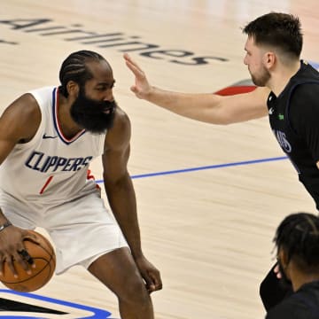 May 3, 2024; Dallas, Texas, USA; LA Clippers guard James Harden (1) looks to move the ball past Dallas Mavericks guard Luka Doncic (77) during the fourth quarter during game six of the first round for the 2024 NBA playoffs at American Airlines Center. Mandatory Credit: Jerome Miron-USA TODAY Sports