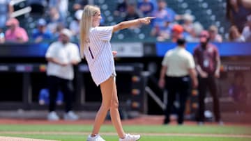 Viral internet star Haliey Welch reacts after throwing out a ceremonial first pitch before a game between the New York Mets.