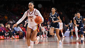 Jan 12, 2025; Los Angeles, California, USA; USC Trojans guard Kennedy Smith (11) drives the ball toward the basket as Penn State Nittany Lions forward Tamera Johnson (5) and Penn State Nittany Lions forward Ariana Williams (11) trail during the fourth quarter at Galen Center. Mandatory Credit: Robert Hanashiro-Imagn Images