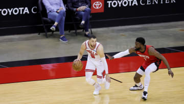 Feb 22, 2021; Houston, Texas, USA; Zach LaVine #8 of the Chicago Bulls controls the ball ahead of David Nwaba #2 of the Houston Rockets during the second quarter at Toyota Center. 