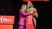 Apr 14, 2025; New York, New York, USA; Kiki Iriafen poses with WNBA commissioner Cathy Engelbert after being selected with the number four overall pick to the Washington Mystics in the 2025 WNBA Draft at The Shed at Hudson Yards. Mandatory Credit: Vincent Carchietta-Imagn Images 