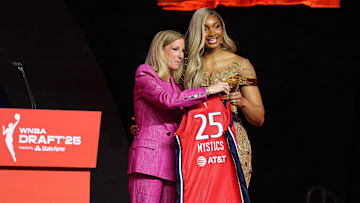 Apr 14, 2025; New York, New York, USA; Kiki Iriafen poses with WNBA commissioner Cathy Engelbert after being selected with the number four overall pick to the Washington Mystics in the 2025 WNBA Draft at The Shed at Hudson Yards. Mandatory Credit: Vincent Carchietta-Imagn Images 