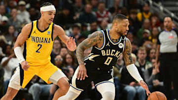 Milwaukee Bucks guard Damian Lillard drives against Indiana Pacers guard Andrew Nembhard during the 2024 NBA Playoffs