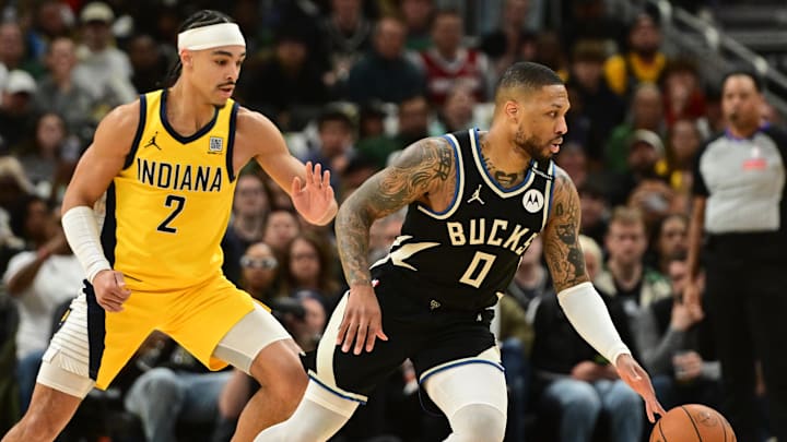 Milwaukee Bucks guard Damian Lillard drives against Indiana Pacers guard Andrew Nembhard during the 2024 NBA Playoffs