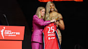 Apr 14, 2025; New York, New York, USA; Kiki Iriafen poses with WNBA commissioner Cathy Engelbert after being selected with the number four overall pick to the Washington Mystics in the 2025 WNBA Draft at The Shed at Hudson Yards. Mandatory Credit: Vincent Carchietta-Imagn Images 