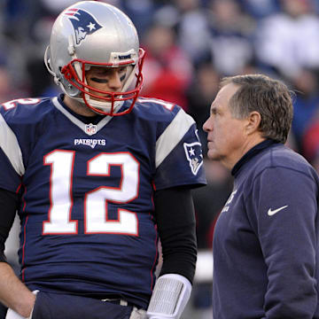 Jan 16, 2016; Foxborough, MA, USA; New England Patriots quarterback Tom Brady (12) talks with New England Patriots head coach Bill Belichick before the game against the Kansas City Chiefs in the AFC Divisional round playoff game at Gillette Stadium.