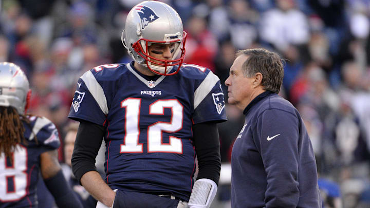 Jan 16, 2016; Foxborough, MA, USA; New England Patriots quarterback Tom Brady (12) talks with New England Patriots head coach Bill Belichick before the game against the Kansas City Chiefs in the AFC Divisional round playoff game at Gillette Stadium.