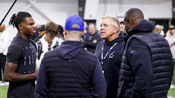 Apr 4, 2025; Boulder, CO, USA; Colorado Buffaloes wide receiver Travis Hunter (12) talks to Denver Broncos head coach Sean Payton after the University of Colorado NFL Showcase at the CU Indoor Practice Facility. 