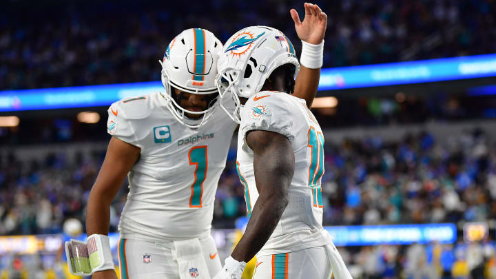 Miami Dolphins wide receiver Tyreek Hill (10) celebrates his touchdown scored against the Los Angeles Chargers with quarterback Tua Tagovailoa (1) during the first half at SoFi Stadium last season.