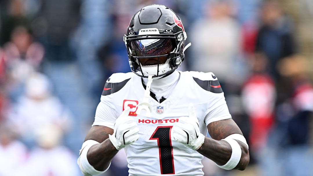 Oct 13, 2024; Foxborough, Massachusetts, USA; Houston Texans wide receiver Stefon Diggs (1) reacts before a game against the New England Patriots at Gillette Stadium. Mandatory Credit: Brian Fluharty-Imagn Images