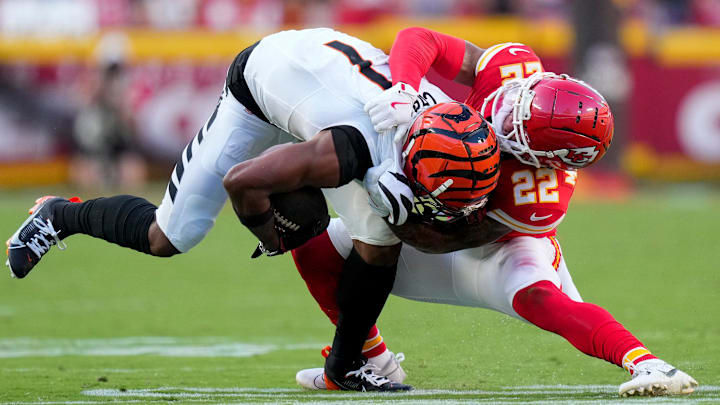 Kansas City Chiefs cornerback Trent McDuffie (22) brings down Cincinnati Bengals wide receiver Ja'Marr Chase (1) in the fourth quarter of the NFL Week 2 game between the Kansas City Chiefs and the Cincinnati Bengals at Arrowhead Stadium in Kansas City on Sunday, Sept. 15, 2024. The Chiefs took a 26-25 win with a go-ahead field goal as time expired.