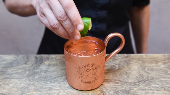 Bartender finishing making Moscow mule