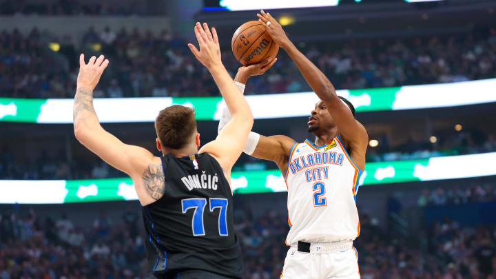 May 18, 2024; Dallas, Texas, USA; Oklahoma City Thunder guard Shai Gilgeous-Alexander (2) shoots over Dallas Mavericks guard Luka Doncic (77) during the first quarter in game six of the second round of the 2024 NBA playoffs at American Airlines Center. Mandatory Credit: Kevin Jairaj-USA TODAY Sports