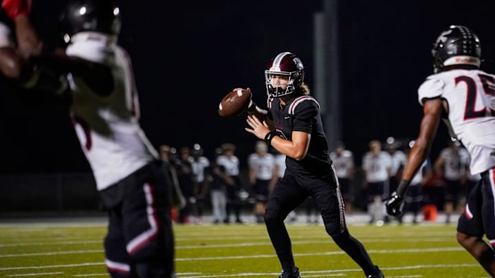 First Baptist Academy Lions quarterback Brady Quinn (8) scrambles while looking for a receiver during the second quarter of a game against the Port Charlotte Pirates at First Baptist Academy in Naples on Friday, Sept. 20, 2024. First Baptist Academy Lions quarterback Brady Quinn (8) scrambles while looking for a receiver during the second quarter of a game against the Port Charlotte Pirates at First Baptist Academy in Naples on Friday, Sept. 20, 2024.