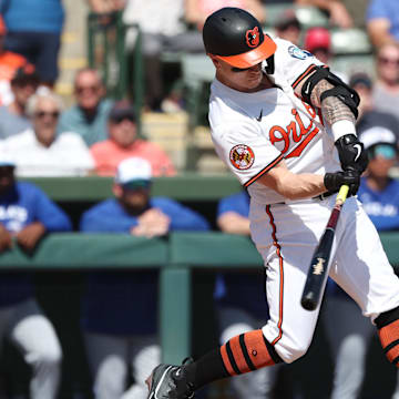Feb 27, 2025; Sarasota, Florida, USA;  Baltimore Orioles outfielder Tyler O'Neill (9) hits a 3-run home run during the second inning against the Toronto Blue Jays at Ed Smith Stadium. 