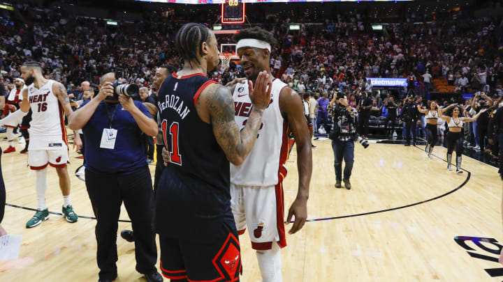 Apr 14, 2023; Miami, Florida, USA; Miami Heat forward Jimmy Butler (22) talks to Chicago Bulls forward DeMar DeRozan (11) after the game at Kaseya Center. Mandatory Credit: Sam Navarro-USA TODAY Sports