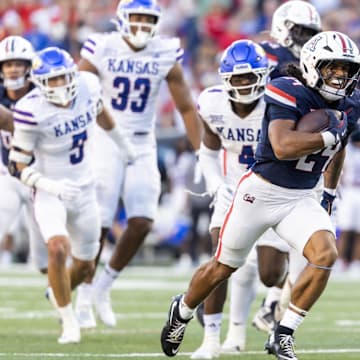 Nov 8, 2025; Tucson, Arizona, USA; Arizona Wildcats running back Quincy Craig (24) runs for a touchdown against the Kansas Jayhawks in the second half at Arizona Stadium. Mandatory Credit: Mark J. Rebilas-Imagn Images