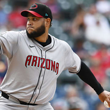 Aug 7, 2024; Cleveland, Ohio, USA; Arizona Diamondbacks starting pitcher Eduardo Rodriguez (57) throws a pitch during the first inning against the Cleveland Guardians at Progressive Field. Mandatory Credit: Ken Blaze-Imagn Images