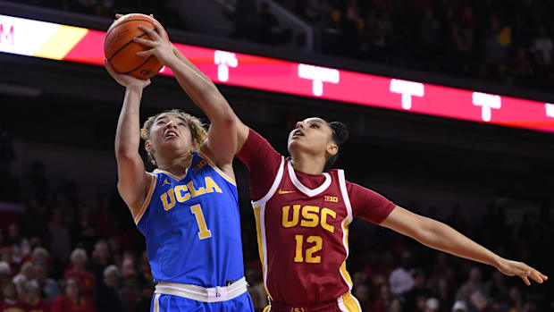 UCLA Bruins guard Kiki Rice (1) drives to the basket against USC Trojans guard JuJu Watkins (12) during the first quarter