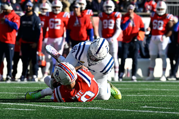 New England Patriots quarterback Drake Maye (10) is sacked by Indianapolis Colts defensive tackle DeForest Buckner