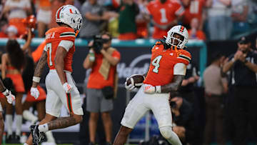 Sep 13, 2025; Miami Gardens, Florida, USA; Miami Hurricanes running back Mark Fletcher Jr. (4) celebrates after scoring a touchdown against the South Florida Bulls during the second quarter at Hard Rock Stadium. Mandatory Credit: Sam Navarro-Imagn Images