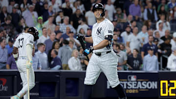Sep 30, 2025; Bronx, New York, USA; New York Yankees designated hitter Giancarlo Stanton (27) reacts after striking out with the bases loaded during the ninth inning of game one of the Wildcard round of the 2025 MLB playoffs against the Boston Red Sox at Yankee Stadium. Mandatory Credit: Brad Penner-Imagn Images