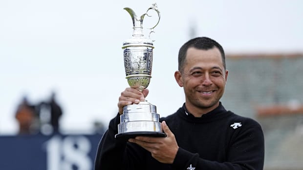 Xander Schauffele celebrates with Claret Jug after winning the Open Championship golf tournament at Royal Troon.