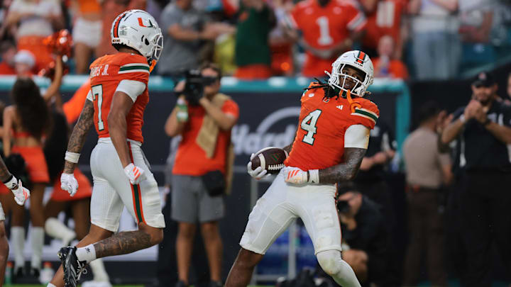 Sep 13, 2025; Miami Gardens, Florida, USA; Miami Hurricanes running back Mark Fletcher Jr. (4) celebrates after scoring a touchdown against the South Florida Bulls during the second quarter at Hard Rock Stadium. Mandatory Credit: Sam Navarro-Imagn Images