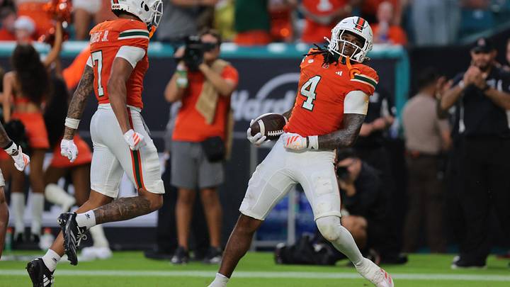 Sep 13, 2025; Miami Gardens, Florida, USA; Miami Hurricanes running back Mark Fletcher Jr. (4) celebrates after scoring a touchdown against the South Florida Bulls during the second quarter at Hard Rock Stadium. Mandatory Credit: Sam Navarro-Imagn Images