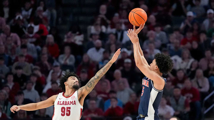 Dec 13, 2025; Birmingham, AL, USA; Arizona guard Brayden Burries (5) shoots a three over Alabama guard Houston Mallette (95) at Legacy Arena. Mandatory Credit: Gary Cosby Jr.-Tuscaloosa News