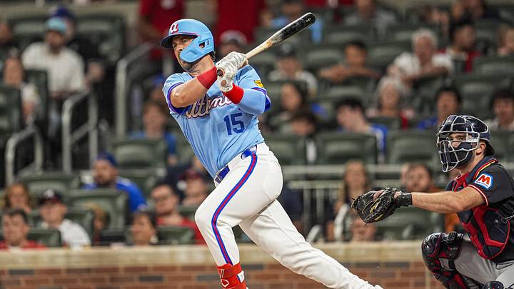 Apr 12, 2026; Cumberland, Georgia, USA; Atlanta Braves pinch hitter Kyle Farmer (15) hits a double to drive in two runs against the Cleveland Guardians during the fifth inning at Truist Park. Mandatory Credit: Dale Zanine-Imagn Images