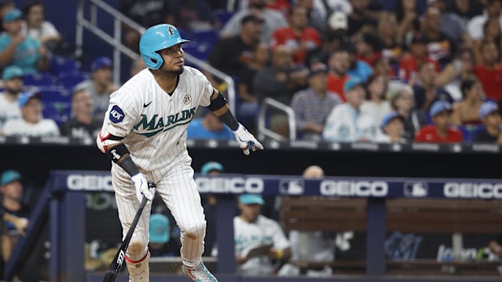 Sep 15, 2023; Miami, Florida, USA; Miami Marlins second baseman Luis Arraez (3) hits a home run against the Atlanta Braves during the seventh inning at loanDepot Park. Mandatory Credit: Rhona Wise-Imagn Images