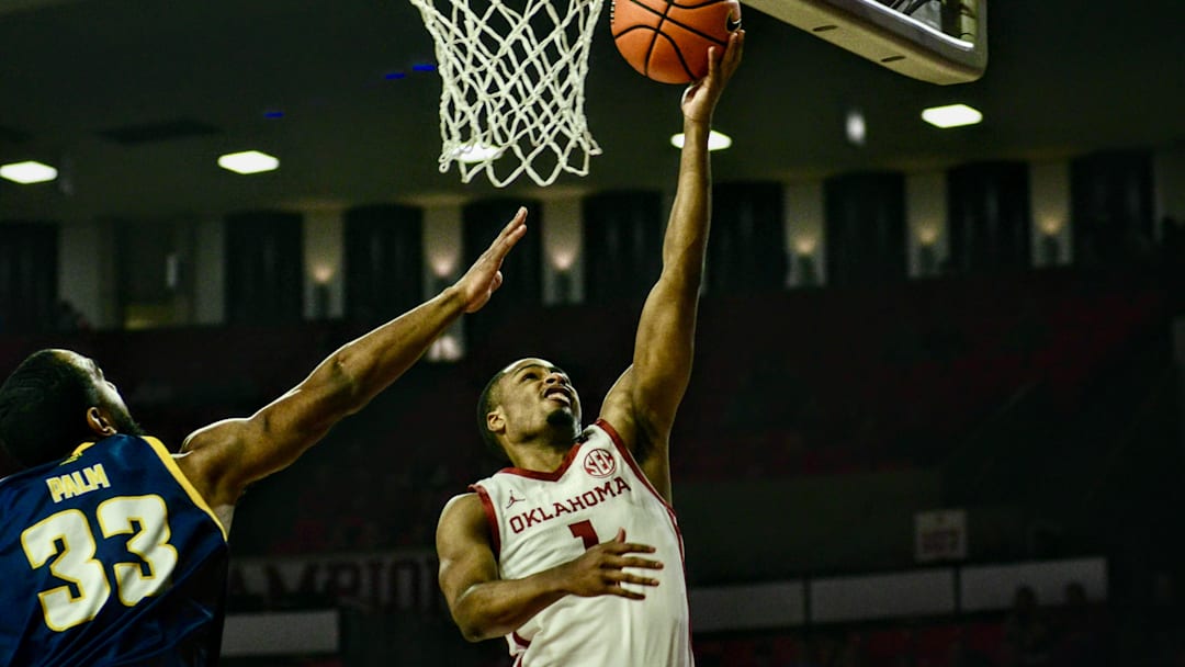 Oklahoma guard Xzayvier Brown attempts a layup against Kansas City.